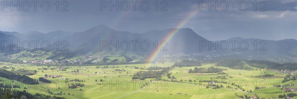Panorama from Grünten over the Illertal with rainbow to Blaichach and Immenstadt, behind Steineberg, 1660m and Mittagberg, 1451m, Allgäu Alps, Allgäu, Bavaria, Germany