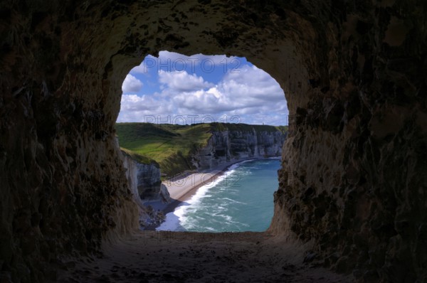 View through the eye of the panda, L'oeil du Panda, rock window, cave, in the rock arch Falaise Courtine, Étretat, sea, steep coast, cliffs, chalk cliffs, alabaster coast, La Côte d'Albâtre, Normandy, Seine-Maritime, France