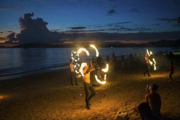 Fire show, jugglers with fire, Ao Nang Beach, sunset, Ao Nang, Krabi, Thailand