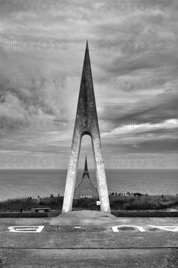 Monument in honour of the French aviators François Coli and Charles Nungesser, behind the church Chapelle Notre Dame de la Garde, black and white, Étretat, Normandy, Seine-Maritime, France