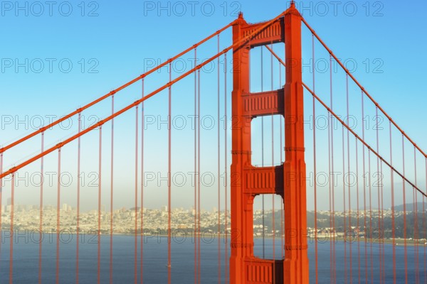 View of Golden Gate Bridge and financial district in the distance, San Francisco, California, USA