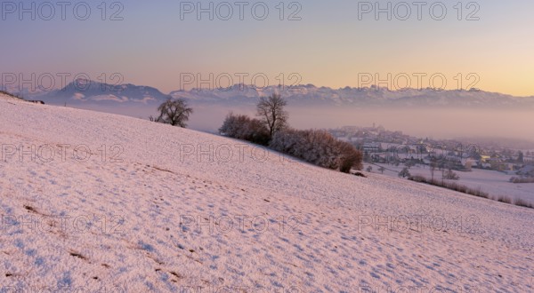 Village in the fog and in the light of dusk, behind the Rigi, Hohenrain, Seetal, Canton Lucerne, Switzerland