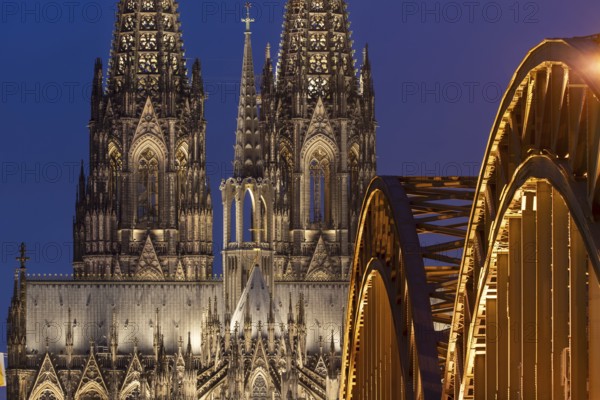Cologne Cathedral and the Hohenzollern Bridge illuminated with LED lights, Cologne, North Rhine-Westphalia, Germany
