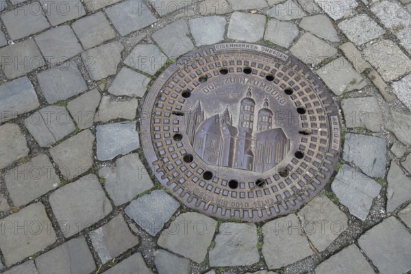 Manhole cover with cathedral as landmark, cobblestones, floor, inscription, cathedral square, Saale, Naumburg, Saxony-Anhalt, Germany