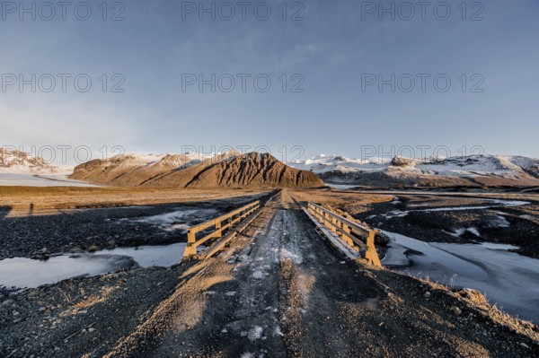 Unpaved road, bridge, glacier Vatnajökull, ice, rocks, lake, sunset, winter, cold, Iceland* Gravel Road, Bridge, Vatnajokul, Ice, Rocks, Lake, Sunset, Cold, Iceland