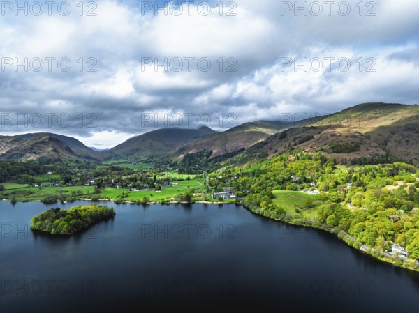 Farms and Mountains over road A591 from a drone, Grasmere Lake, Grasmere, Ambleside, Lake District, Westmorland, Cumbria, UK