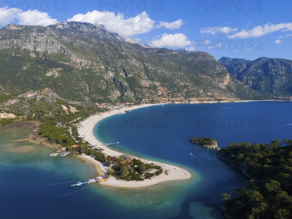 Aerial view of a picturesque coastline with sandy beach, mountains and clear water under a blue sky, aerial view, Fethiye, Mugla, Mugla, Aegean Sea, Turkey