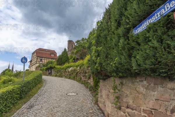 Path to the medieval Hanstein castle ruins, built on a red sandstone rock, Bornhagen, Eichsfeld district, historical architecture, round tower, Thuringia, Germany
