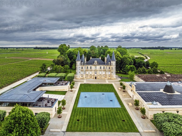 Chateau Pichon Longueville Baron Vineyard and grape fields around Pauillac from a drone, Bordeaux, Gironde, Nouvelle-Aquitaine, France