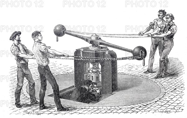 Worker at a mint, coin minting block, moved by human power, 1860, England, digitally enhanced reproduction of a 19th century model, historical