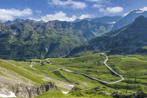 View from elevated position on last section of south ramp alpine road pass road mountain road ascent to descent from border pass Great Saint Bernard Colle del Gran San Bernardo Col du Grand Gd Saint Bernard, Valle d'Aosta region, Italy