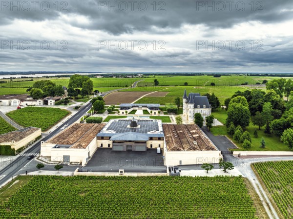 Chateau Pichon Longueville Baron Vineyard and grape fields around Pauillac from a drone, Bordeaux, Gironde, Nouvelle-Aquitaine, France