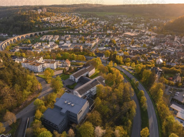 Aerial view of a cityscape with viaduct and surrounding nature, autumn colours, Nagold, Black Forest, Germany