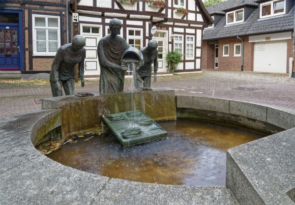 The asparagus fountain in Mühlenstraße, a historical sight in the old town centre of Nienburg an der Weser. Nienburg, Lower Saxony, Germany