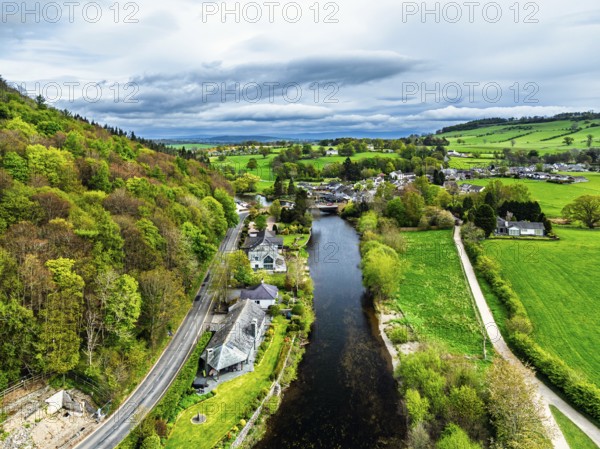 Farms and mountains over Ullswater Lake from drone, Pooley Bridge, Lake District National Park, Cumbria, England, United Kingdom