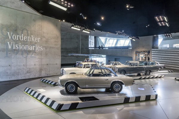 Mercedes-Benz 230 SL from 1964. The vehicle, also known as the Pagoda, has a passenger cell and crumple zone and a particularly stable curved shape of the removable roof pillar. The Mercedes-Benz Museum in Stuttgart presents a journey through the automotive history of the global corporation. The history of the Mercedes star begins with the first automobile in 1886. Stuttgart, Baden-Württemberg, Germany