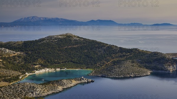 Coastal landscape with hills and blue water under a clear sky, Holy Week, Panormitis Bay, Panormitis Monastery, Symi, Dodecanese, Greek Islands, Greece