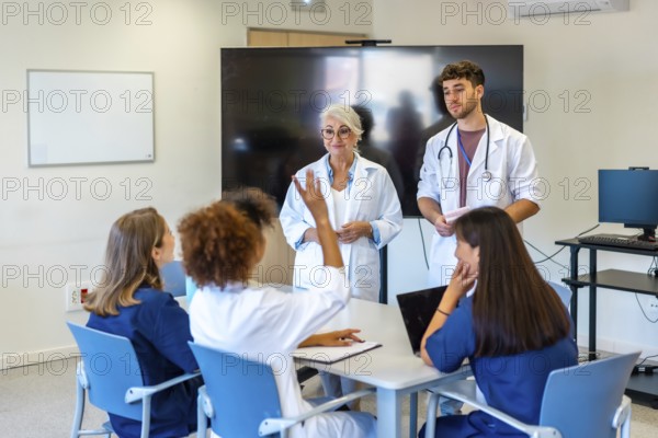 Doctors and nurses participating in a medical conference, sharing insights and expertise for better patient care