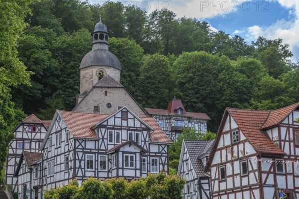 Half-timbered idyll of the old town of Bad Sooden, Allendorf, district of Bad Sooden, townscape with Protestant St. Mary's Church, tower clock, forest, hillside location, restored half-timbered houses, Werra-Meissner district, Hesse, Germany