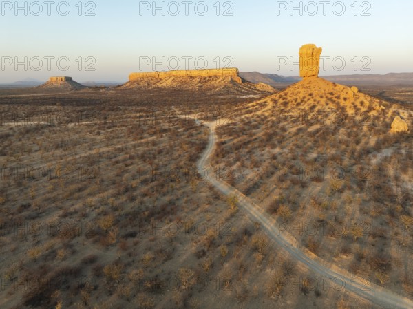 The Vingerklip (rock finger) and the Ugab Valley Terraces are surrounded by thornbush and mopane (Colophospermum mopane) savanna. Aerial view. Drone shot. Damaraland, Namibia