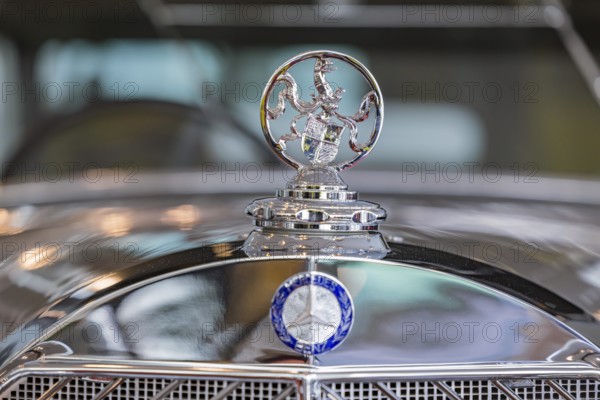 Mercedes-Benz 770 Large Mercedes Cariolet F from 1932, driven by the former German Kaiser Wilhelm II in his exile in Holland. The Hohenzollern coat of arms on the radiator instead of the Mercedes star. The Mercedes-Benz Museum in Stuttgart presents a journey through the automotive history of the global corporation. Collection 4, Gallery of Names. The history of the Mercedes star begins with the first automobile in 1886. 160 vehicles are on display. Stuttgart, Baden-Württemberg, Germany