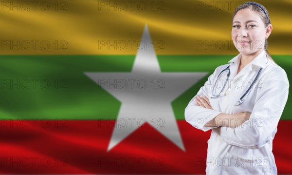Female doctor on Myanmar flag. Doctor with crossed arms on Myanmar flag. Myanmar health and care concept