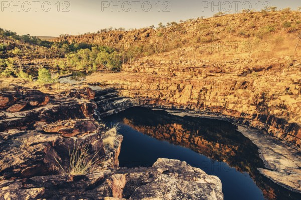 Bell Gorge waterfall, a body of water in north-west Australia in the Kimberley. Sunrise in the outback, Australia
