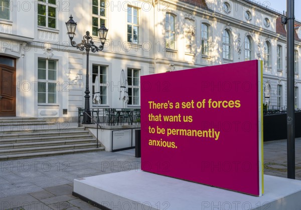 Tony Cokes, visual artist and educator, display panel at the Palais Populaire Unter den Linden, Berlin, Germany