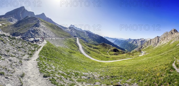 Panoramic view to the left of small car park of 2744 metre high Col Agnel, Colle dell' Agnello in the background southern ramp of Alpine pass above tree line with border marking of national border national border between France Italy on highest border pass in Alps mountain road Alpine road border course, Molines-en-Queyras, Département Hautes-Alpes, Provence-Alpes-Côte d'Azur, France, Pontechianale, Piemont, Italy