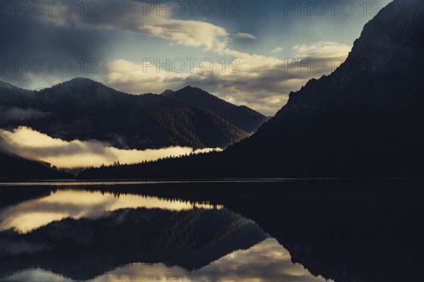 Sunrise with reflections in the Plansee in Tyrol in the Alps in Austria