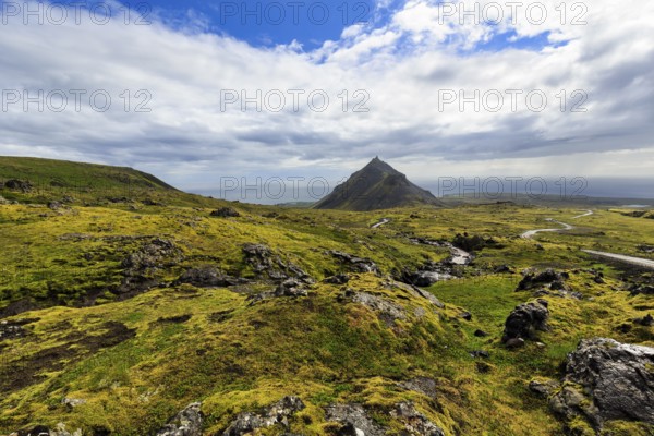 Barren moss-covered volcanic landscape, cone-shaped mountain Stapafell, rain clouds, changeable weather, Arnarstapi, Snaefellsjökull volcanic system, Snaefellsnes peninsula, West Iceland, Iceland