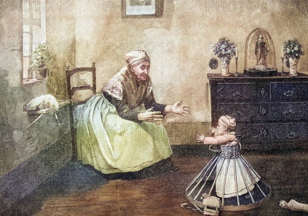 Toddler with walking aid taking his first steps towards his grandmother, coloured wood engraving, reproduction of a model from ca 1888, historical, grandmother encouraging her walking grandchild in the living room