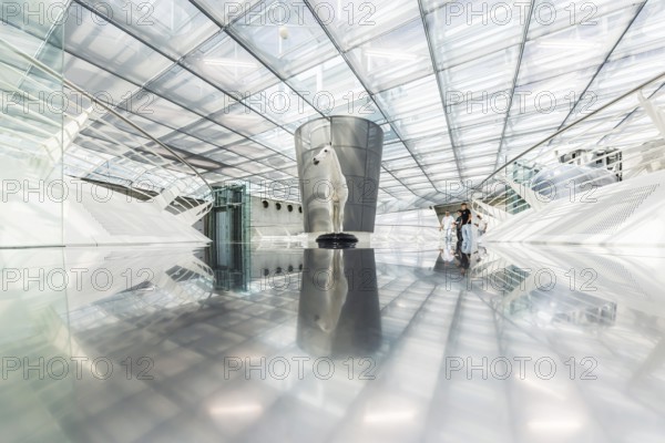 The Mercedes-Benz Museum in Stuttgart presents a journey through the automotive history of the global corporation. The history of the Mercedes star begins with the first automobile in 1886. 160 vehicles are on display. Entrance area with exhibited horse. Stuttgart, Baden-Württemberg, Germany
