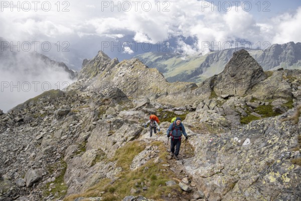 Two mountaineers on a hiking trail, Wiener Höhenweg, Schobergruppe, Hohe Tauern National Park, Carinthia, Austria