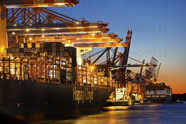 Container ships at the Eurogate container terminal in the evening with an atmospheric sunset, harbour, Hamburg, Germany