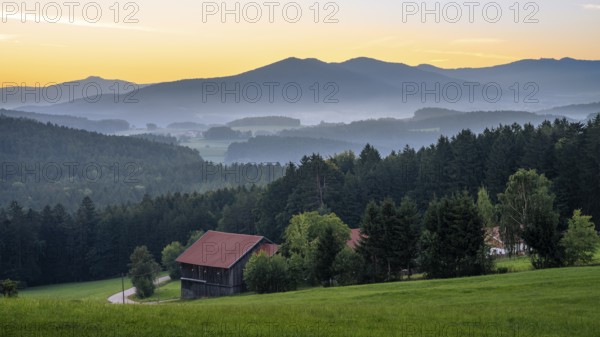 Landscape with forest, meadows and mountains around the town of Bad Kötzting, with the Kaitersberg in the centre. In the morning in front of sunrise. District of Cham, Upper Palatinate, Bavarian Forest, Bavaria, Germany