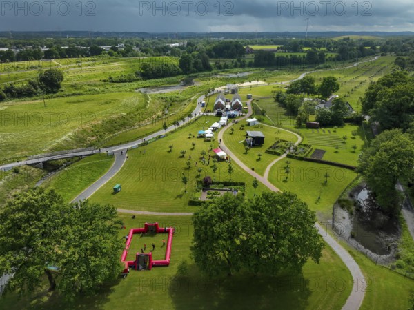 Recklinghausen, Castrop-Rauxel, Ruhr area, North Rhine-Westphalia, Germany - Sports festival in the EMSCHERLAND adventure park, a new nature and water adventure park on the renaturalised Emscher, at the water cross of the Emscher with the Rhine-Herne Canal on the city boundary of Recklinghausen and Castrop-Rauxel. Flood protection by expanding the area. The ecological focus at the confluence of the Suderwicher Bach and Emscher will also become a future garden for the International Garden Exhibition IGA 2027. Before the renaturalisation, the Emscher river system was an open, above-ground wastewater channel, combined sewer with surface water and wastewater