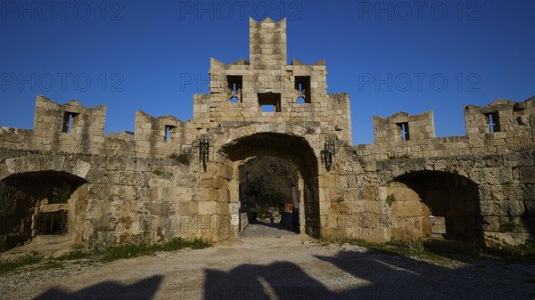 St Paul's Gate, Medieval stone castle gate under a clear blue sky, harbour area, Rhodes Town, Rhodes, Dodecanese, Greek Islands, Greece