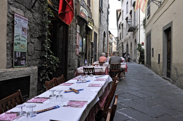 Covered tables, narrow alley with pizzeria, alleyway restaurant, Via San Giovanni, historic centre, Bolsena, Province of Viterbo, Lazio, Italy