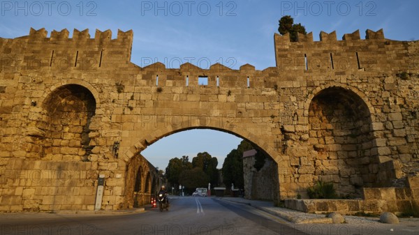 Arsenal gate, Rhodes city wall, Historic stone city gate in evening light, Harbour area, Rhodes city, Rhodes, Dodecanese, Greek Islands, Greece