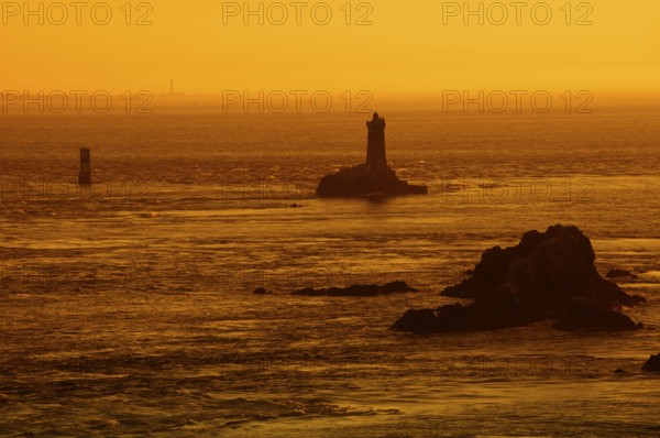 Phare de la Vieille lighthouse at sunset, Pointe du Raz, Cap Sizun, Finistere department, Brittany, France