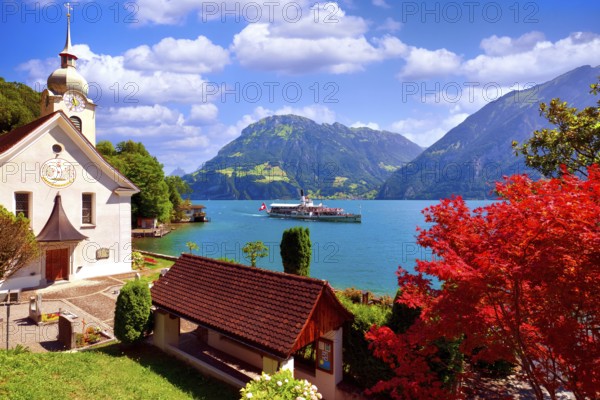 Steamboat on Lake Uri, Roman Catholic church in the village of Bauen, Fronalpstock mountain behind, cantons of Uri and Schwyz, Switzerland