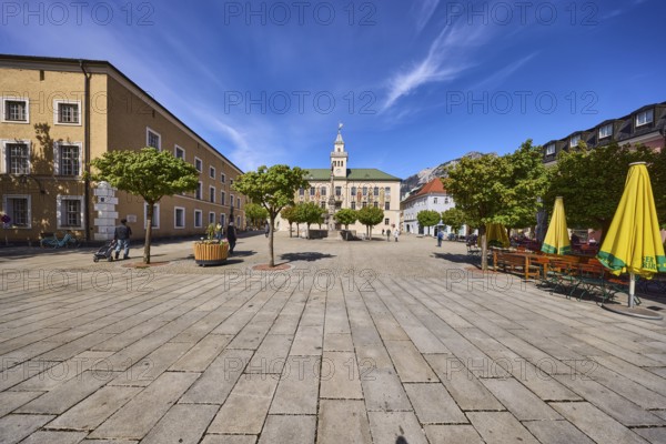 Square, historic town hall, trees, general architecture, outdoor area of a restaurant with parasols, tables and benches, blue sky, cirrostratus clouds, Bad Reichenhall, district Berchtesgadener Land, Bavaria, Germany
