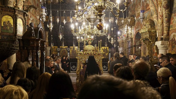 Full church with richly decorated interior and candlelight during a celebration, Epitaphio, Holy Week, Bay of Panormitis, Panormitis Monastery, Symi, Dodecanese, Greek Islands, Greece