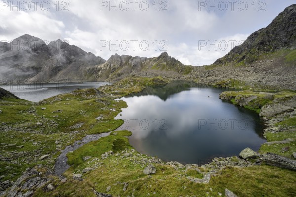 Mountain lakes Wangenitzsee and Kreuzsee, cloudy mountain peaks in the morning, Schober group, Hohe Tauern National Park, Carinthia, Austria