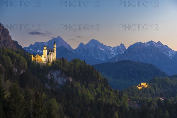 Historic castle in a magical mountain landscape at sunset, Neuschwanstein, Hohenschwangau, Schwangau near Füssen, Ostallgäu district, Swabia, Bavaria, Germany