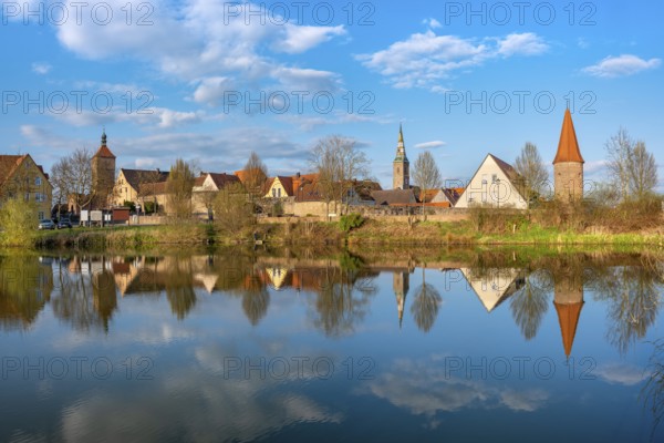 View of the old town in the evening light, Upper Tor, Liebfrauenmünster and Bürgerturm reflected in the town pond, Wolframs-Eschenbach, Middle Franconia, Bavaria, Germany