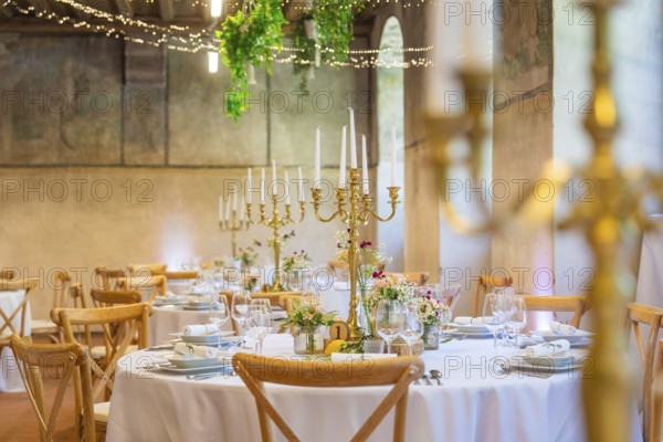 Elegant and romantic wedding tables with candles and natural decoration, event and wedding location Kloster Lorch, Lorch, Germany