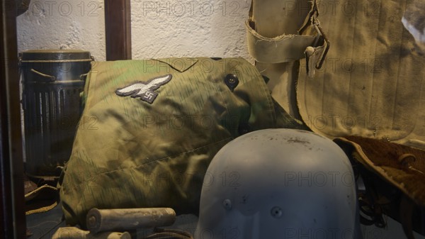 Display case with military equipment such as helmets and insignia, War Museum, Military Museum, Private Military Museum, Platanos, Leros, WW2, Dodecanese, Greek Islands, Greece