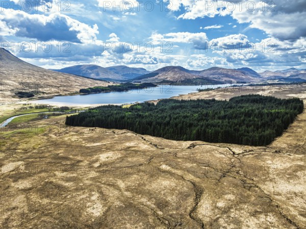 Mountains and Moors over Loch Tulla and River Orchy from a drone, Highlands, Scotland, UK